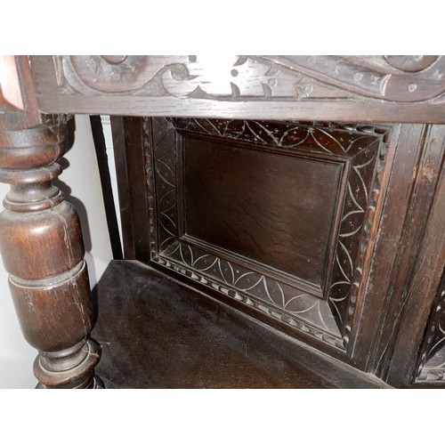 307 - DARK OAK CARVED COURT CUPBOARD  H54