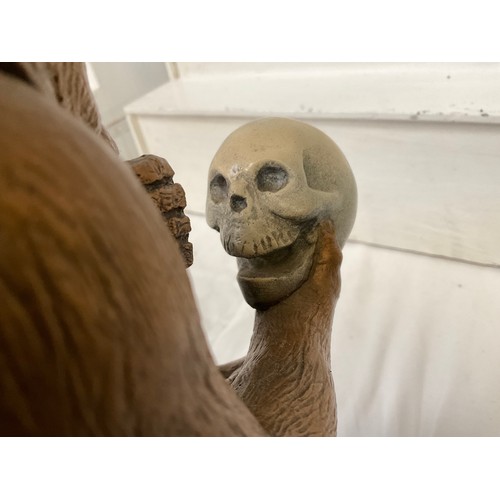 65 - CERAMIC MONKEY SAT ON BOOKS STUDYING A HUMAN SKULL (IMPRESSED MARK AND DATE TO BACK) H14”