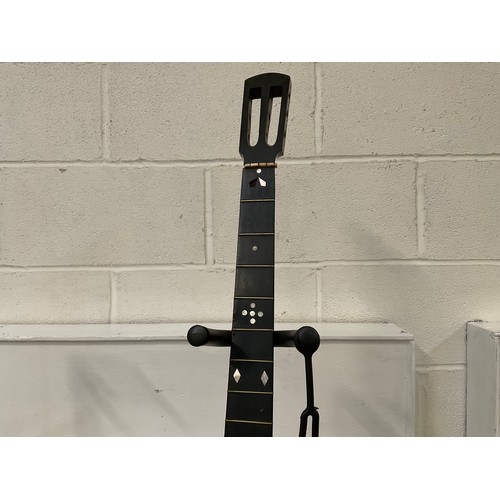 76 - ORNAMENTAL BANJO WITH RECORD TO FRONT UKULELE CASE AND VOILIN IN CASE AND TWO GUITAR STANDS