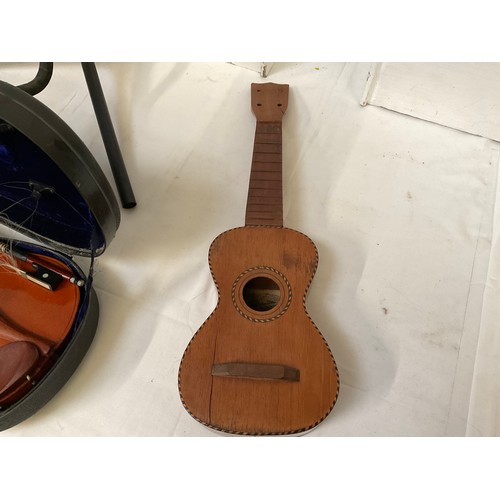 76 - ORNAMENTAL BANJO WITH RECORD TO FRONT UKULELE CASE AND VOILIN IN CASE AND TWO GUITAR STANDS