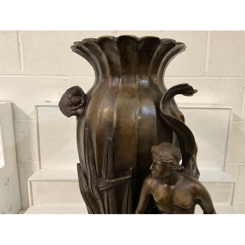 85 - SOLID HEAVY BRONZE VASE DECORATED WITH FOILAGE MAN AND HIS DOG (DOG IS LOOSE) H31”