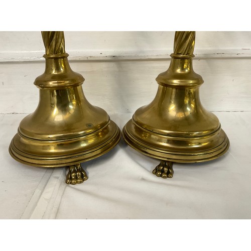 90 - PAIR OF LARGE BRASS RELIGOUS ATLAR CANDLESTICKS WITH TWISTED STEMS AND RISEN ON LIONS PAW FEET H22”