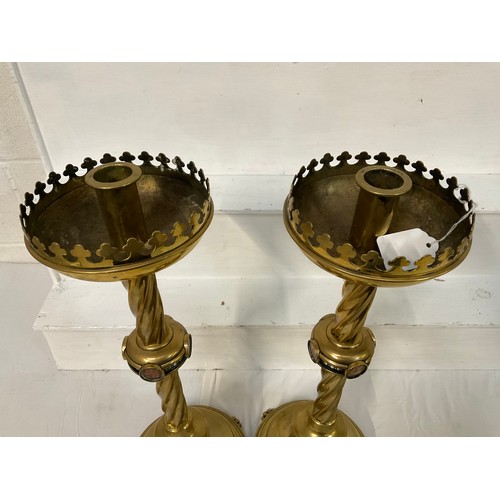 90 - PAIR OF LARGE BRASS RELIGOUS ATLAR CANDLESTICKS WITH TWISTED STEMS AND RISEN ON LIONS PAW FEET H22”