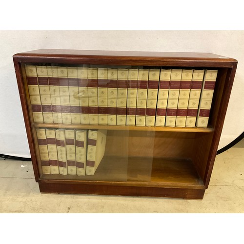 94 - SLIDING GLASS BOOKCASE AND COMPLETE SET OF 24 VOLUMES ENCYCLOPEDIA BRITANNICA H31” D11” W37.5”