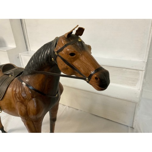 99 - LEATHER HORSE COMPLETE WITH SADDLE H21” L24”