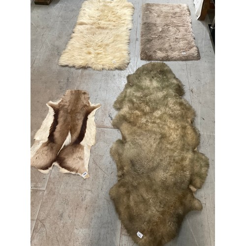 166 - 3 FUR RUGS AND A ANIMAL SKIN EXAMPLE