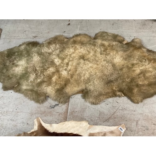 166 - 3 FUR RUGS AND A ANIMAL SKIN EXAMPLE