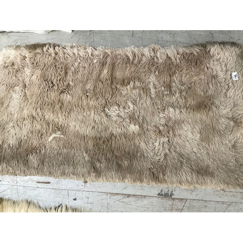 166 - 3 FUR RUGS AND A ANIMAL SKIN EXAMPLE