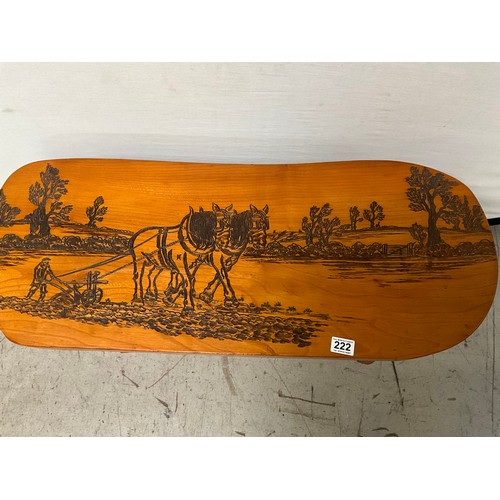 222 - PINE COFFEE TABLE WITH CARVING TO TOP OF HORSES PLOUGHING A FIELD L34” H15” D14”