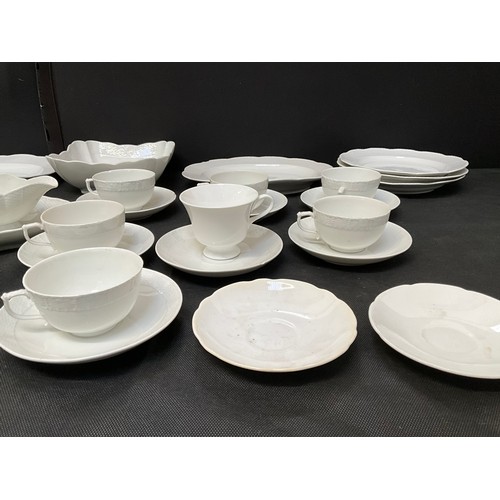 8 - A LARGE WHITE DINNER SERVICE TO INCLUDE DINNER PLATES TEA PLATES BOWLS CHEESE DISH ETC