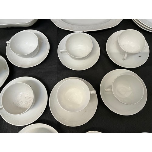 8 - A LARGE WHITE DINNER SERVICE TO INCLUDE DINNER PLATES TEA PLATES BOWLS CHEESE DISH ETC