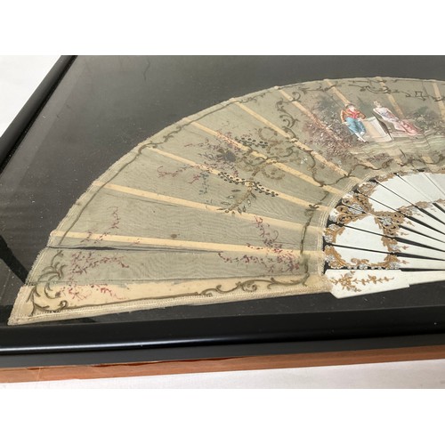 37 - FRAMED SILK FAN DEPICTING ROMANTIC SCENE 15”X25”