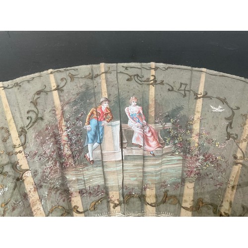 37 - FRAMED SILK FAN DEPICTING ROMANTIC SCENE 15”X25”