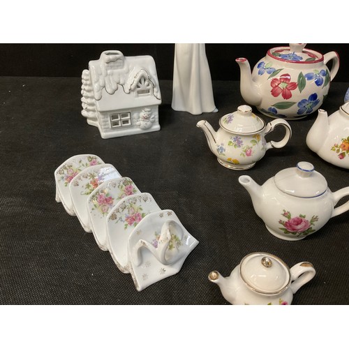 128 - A BOX OF MINIATURE CHINA COLLECTABLE TO INCLUDE TEA POTS ETC