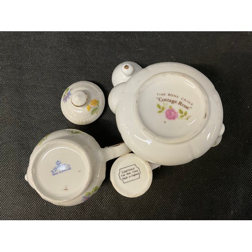 128 - A BOX OF MINIATURE CHINA COLLECTABLE TO INCLUDE TEA POTS ETC