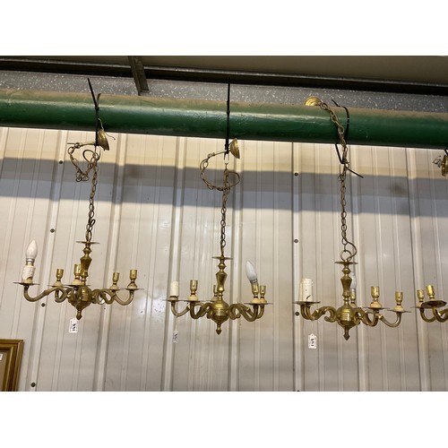 149 - SEVEN BRASS HANGING ELECTRIC CHANDELIERS AND FREE MATCHING WALL LIGHTS