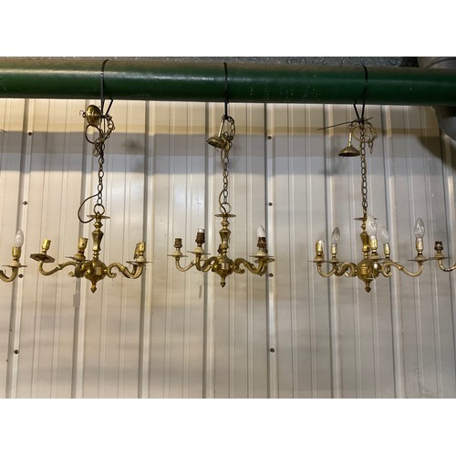 149 - SEVEN BRASS HANGING ELECTRIC CHANDELIERS AND FREE MATCHING WALL LIGHTS