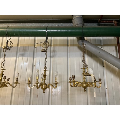 149 - SEVEN BRASS HANGING ELECTRIC CHANDELIERS AND FREE MATCHING WALL LIGHTS