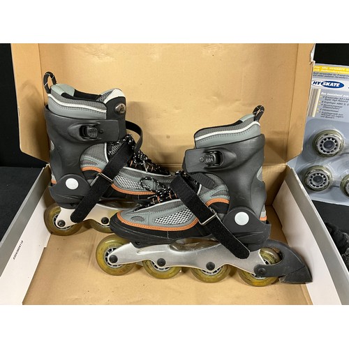 162 - BOXED PAIR OF ROLLER BOOTS WITH SPARE ROLLERS