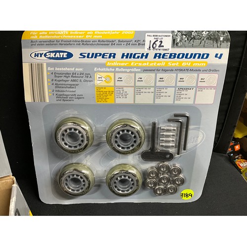 162 - BOXED PAIR OF ROLLER BOOTS WITH SPARE ROLLERS