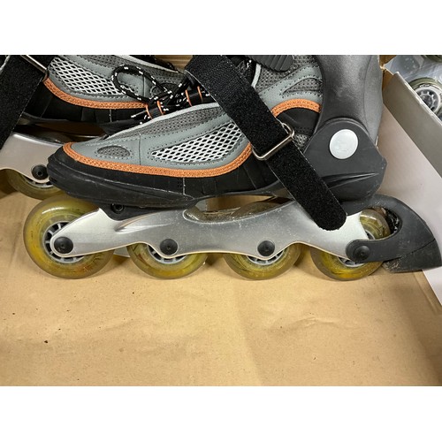 162 - BOXED PAIR OF ROLLER BOOTS WITH SPARE ROLLERS