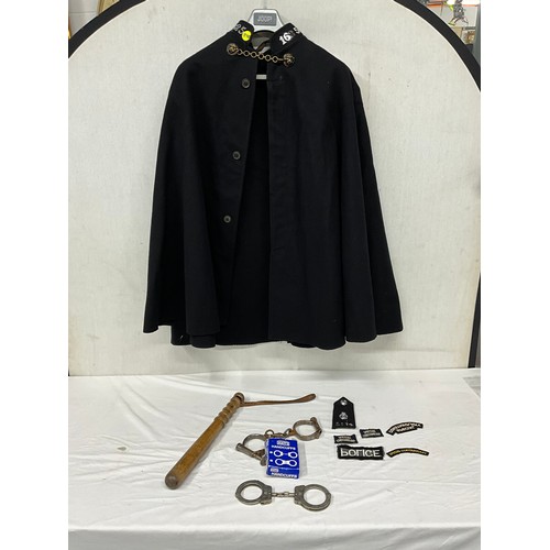251 - VINTAGE POLICEMANS CLOAK TRUNCHEON HAND CUFFS ETC