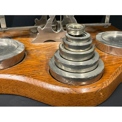 103 - LARGE SET OF EDWARDIAN  PARCEL SCALES AND WEIGHTS ON OAK BASE