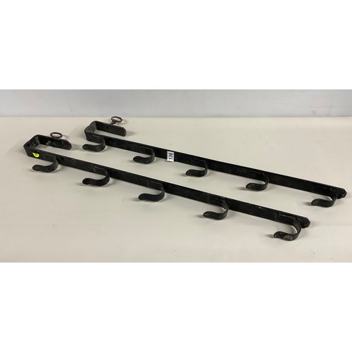 136 - PAIR OF METAL GUN RACKS 35