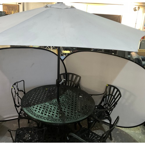 226 - LAGE CIRCULAR METAL GARDEN TABLE WITH PARASOL AND 3 MATCHING AND 2 ODD CHAIRS