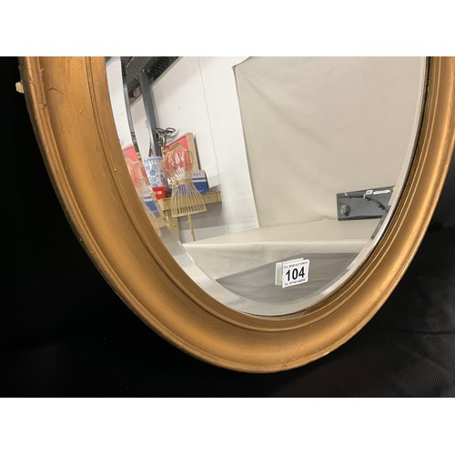104 - EDWARDIAN GILT FRAMED OVAL WALL MIRROR A/F 23