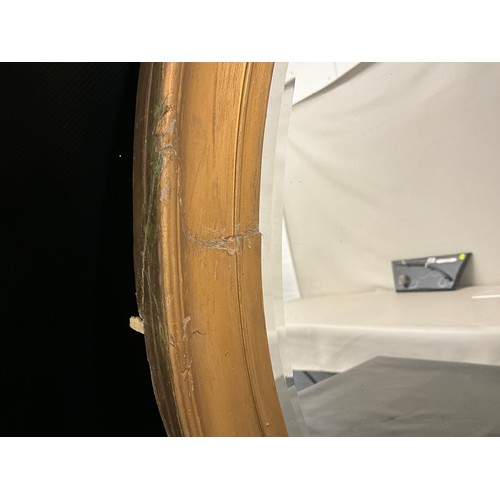 104 - EDWARDIAN GILT FRAMED OVAL WALL MIRROR A/F 23