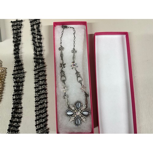 106 - 2 BOXES OF COSTUME JEWELLERY TO INCLUDE NECKLACES, WATCHES, BROOCHES, CUFFLINKS ETC