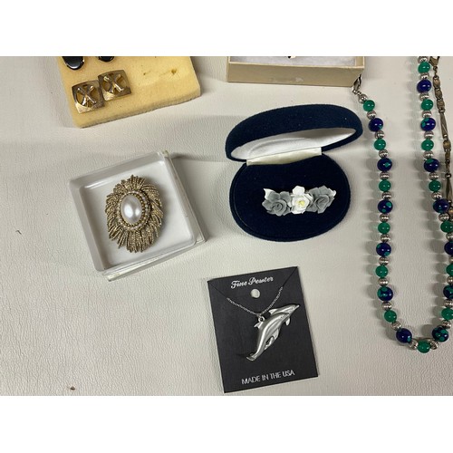 106 - 2 BOXES OF COSTUME JEWELLERY TO INCLUDE NECKLACES, WATCHES, BROOCHES, CUFFLINKS ETC