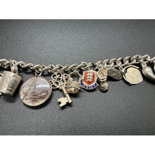 1 - HALLMARKED SILVER CHARM BRACELET WITH 16 SILVER & WHITE METAL CHARMS TW 58.9G LOCKET IS HALLMARK ENG... 