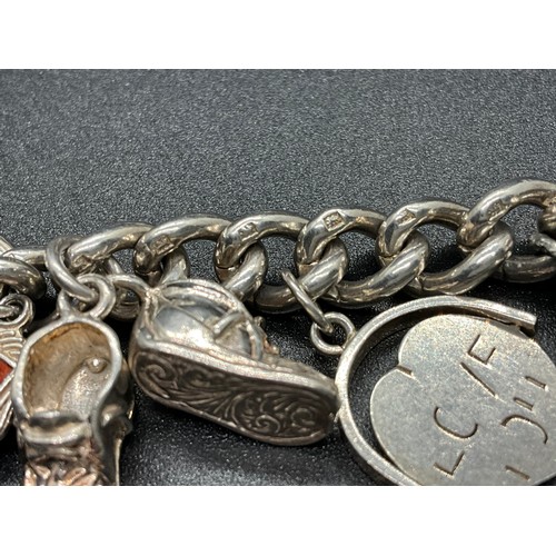 1 - HALLMARKED SILVER CHARM BRACELET WITH 16 SILVER & WHITE METAL CHARMS TW 58.9G LOCKET IS HALLMARK ENG... 