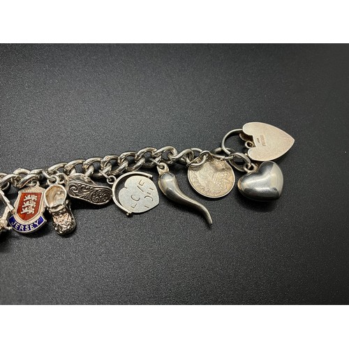 1 - HALLMARKED SILVER CHARM BRACELET WITH 16 SILVER & WHITE METAL CHARMS TW 58.9G LOCKET IS HALLMARK ENG... 