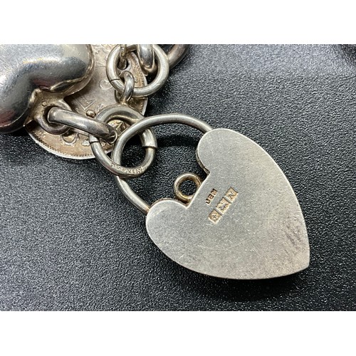1 - HALLMARKED SILVER CHARM BRACELET WITH 16 SILVER & WHITE METAL CHARMS TW 58.9G LOCKET IS HALLMARK ENG... 