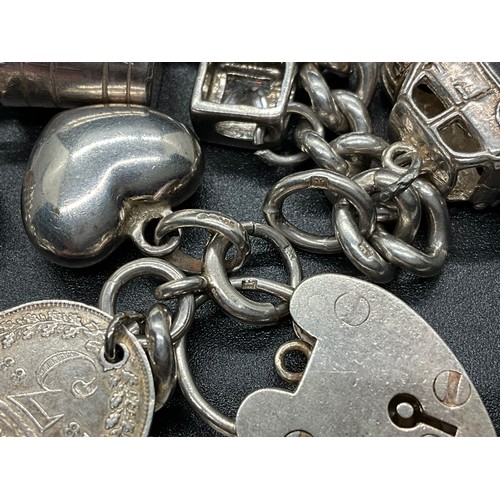 1 - HALLMARKED SILVER CHARM BRACELET WITH 16 SILVER & WHITE METAL CHARMS TW 58.9G LOCKET IS HALLMARK ENG... 