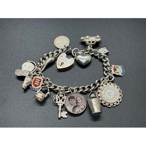 1 - HALLMARKED SILVER CHARM BRACELET WITH 16 SILVER & WHITE METAL CHARMS TW 58.9G LOCKET IS HALLMARK ENG... 