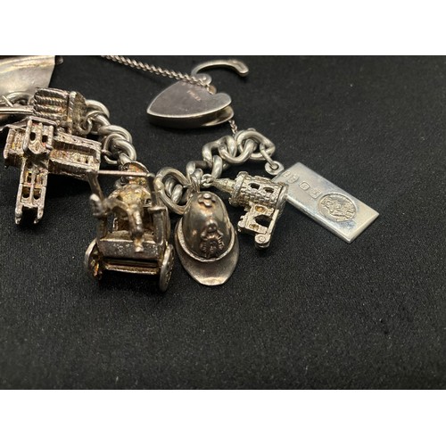 4 - HALLMARKED SILVER CHARM BRACELET WITH 22 CHARMS SILVER & WHITE METAL TW 85.8G - ENGLISH HALLMARK SIL... 