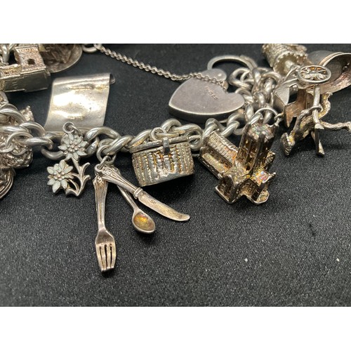 4 - HALLMARKED SILVER CHARM BRACELET WITH 22 CHARMS SILVER & WHITE METAL TW 85.8G - ENGLISH HALLMARK SIL... 