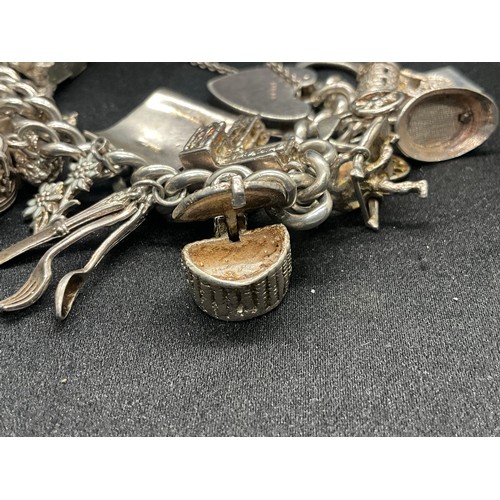 4 - HALLMARKED SILVER CHARM BRACELET WITH 22 CHARMS SILVER & WHITE METAL TW 85.8G - ENGLISH HALLMARK SIL... 
