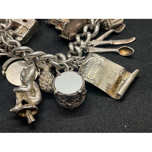 4 - HALLMARKED SILVER CHARM BRACELET WITH 22 CHARMS SILVER & WHITE METAL TW 85.8G - ENGLISH HALLMARK SIL... 