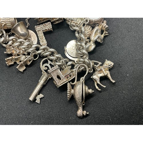 4 - HALLMARKED SILVER CHARM BRACELET WITH 22 CHARMS SILVER & WHITE METAL TW 85.8G - ENGLISH HALLMARK SIL... 