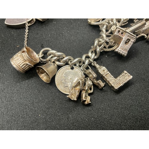 4 - HALLMARKED SILVER CHARM BRACELET WITH 22 CHARMS SILVER & WHITE METAL TW 85.8G - ENGLISH HALLMARK SIL... 