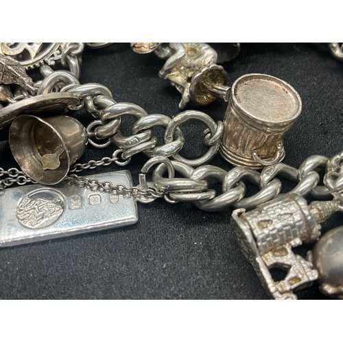 4 - HALLMARKED SILVER CHARM BRACELET WITH 22 CHARMS SILVER & WHITE METAL TW 85.8G - ENGLISH HALLMARK SIL... 