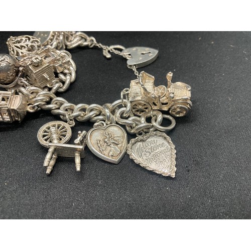 5 - HALLMARKED SILVER CHARM BRACELET WITH 14 SILVER & WHITE METAL CHARMS TW83G - LOCKET IS CONTINENTAL S... 
