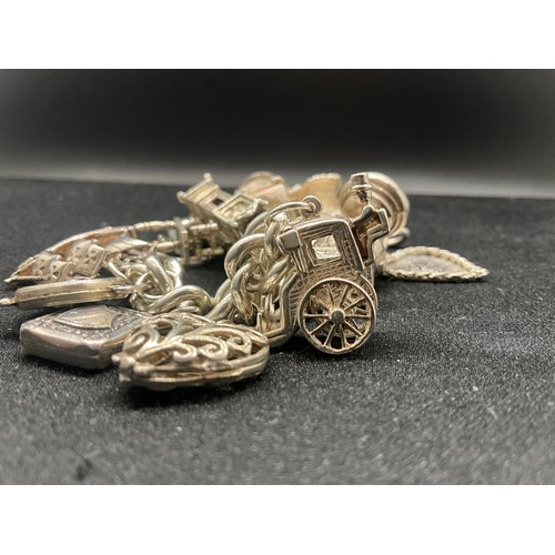 5 - HALLMARKED SILVER CHARM BRACELET WITH 14 SILVER & WHITE METAL CHARMS TW83G - LOCKET IS CONTINENTAL S... 