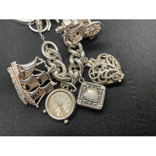 5 - HALLMARKED SILVER CHARM BRACELET WITH 14 SILVER & WHITE METAL CHARMS TW83G - LOCKET IS CONTINENTAL S... 