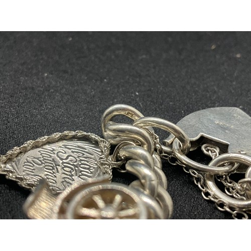 5 - HALLMARKED SILVER CHARM BRACELET WITH 14 SILVER & WHITE METAL CHARMS TW83G - LOCKET IS CONTINENTAL S... 